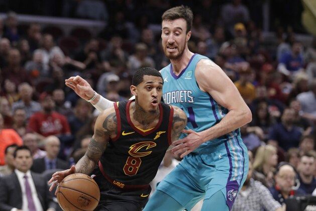 Cleveland Cavaliers' Jordan Clarkson (8) drives past Charlotte Hornets' Frank Kaminsky (44) in the first half of an NBA basketball game, Tuesday, April 9, 2019, in Cleveland. (AP Photo/Tony Dejak)