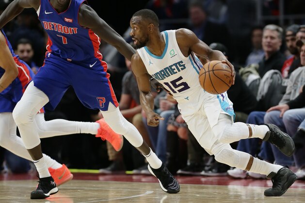 Charlotte Hornets guard Kemba Walker (15) drives against Detroit Pistons forward Thon Maker (7) during the first half of an NBA basketball game Sunday, April 7, 2019, in Detroit. (AP Photo/Duane Burleson)