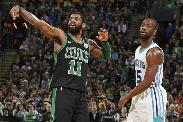 BOSTON, MA - DECEMBER 23:  Kyrie Irving #11 of the Boston Celtics and Kemba Walker #15 of the Charlotte Hornets looks on during the game on December 23, 2018 at the TD Garden in Boston, Massachusetts.  NOTE TO USER: User expressly acknowledges and agrees that, by downloading and or using this photograph, User is consenting to the terms and conditions of the Getty Images License Agreement. Mandatory Copyright Notice: Copyright 2018 NBAE  (Photo by Brian Babineau/NBAE via Getty Images)