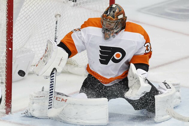 Philadelphia Flyers goaltender Cam Talbot (33) defends the goal against the Dallas Stars during the third period of an NHL hockey game in Dallas, Tuesday, April 2, 2019. The Star won 6-2. (AP Photo/LM Otero)