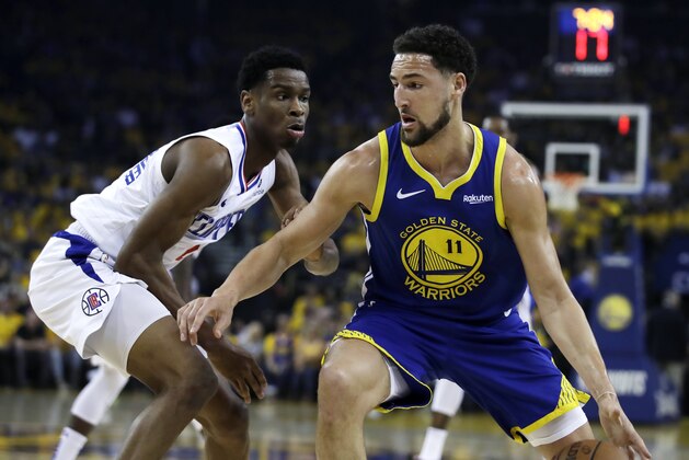 Golden State Warriors' Klay Thompson, right, drives the ball against Los Angeles Clippers' Shai Gilgeous-Alexander during the first half in Game 5 of a first-round NBA basketball playoff series, Wednesday, April 24, 2019, in Oakland, Calif. (AP Photo/Ben Margot)