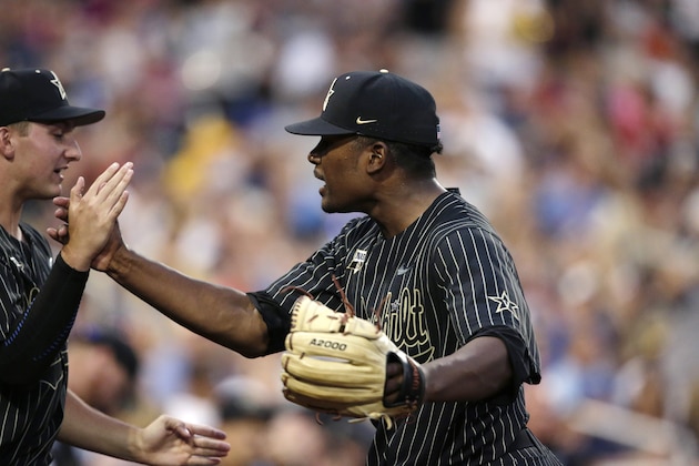 Vanderbilt pitcher Kumar Rockeer reacts at the end of the sixth inning against Michigan in Game 2 of the NCAA College World Series baseball finals in Omaha, Neb., Tuesday, June 25, 2019. (AP Photo/Nati Harnik)
