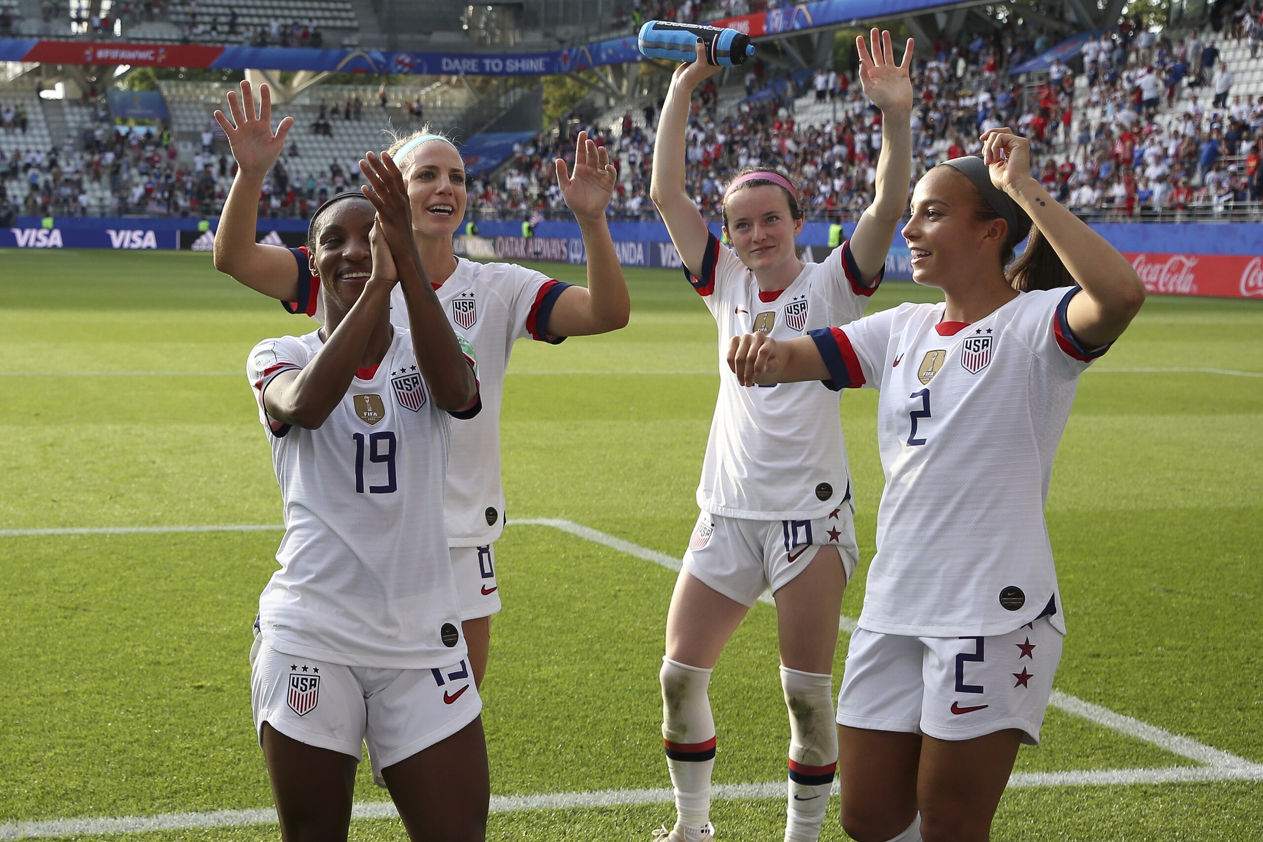 REIMS, FRANCE - JUNE 24: Crystal Dunn, Julie Ertz, Rose Lavelle, Mallory Pugh of USA celebrate the victory with the supporters following the 2019 FIFA Women's World Cup France Round Of 16 match between Spain and USA at Stade Auguste Delaune on June 24, 2019 in Reims, France. (Photo by Jean Catuffe/Getty Images)