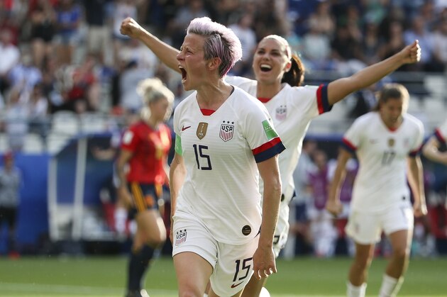 REIMS, FRANCE - JUNE 24: Megan Rapinoe of USA celebrates her winning goal on a penalty kick with Alex Morgan (#13) during the 2019 FIFA Women's World Cup France Round Of 16 match between Spain and USA at Stade Auguste Delaune on June 24, 2019 in Reims, France. (Photo by Jean Catuffe/Getty Images)