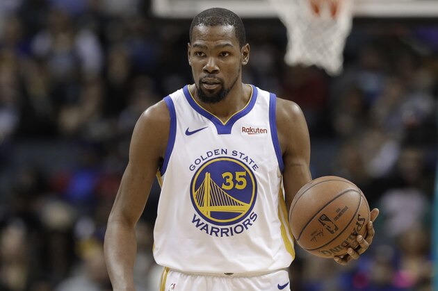 Golden State Warriors' Kevin Durant (35) brings the ball up court during the second half of an NBA basketball game against the Charlotte Hornets in Charlotte, N.C., Monday, Feb. 25, 2019. (AP Photo/Chuck Burton)