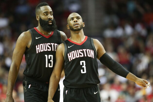 Houston Rockets guard Chris Paul (3) and guard James Harden talk during a timeout during the second half of an NBA basketball game against the Brooklyn Nets, Monday, Nov. 27, 2017, in Houston. Houston won the game 117-103. (AP Photo/Eric Christian Smith)