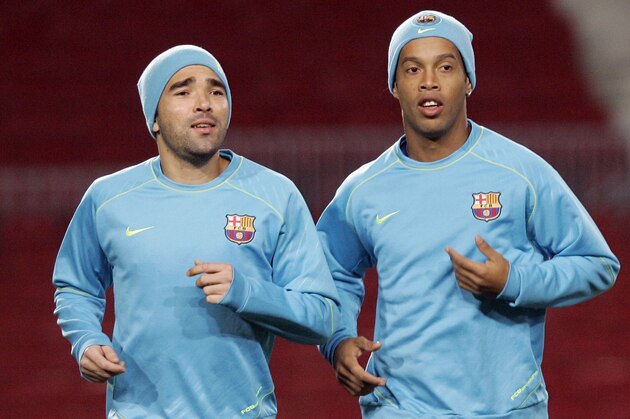 FC Barcelona player Ronaldinho, from Brazil, right, and his teammate Deco attend a training session in Barcelona, Spain, Tuesday, Dec. 11, 2007. FC Barcelona will play against Stuttgart on Wednesday, Dec. 12, in a Group E Champions League soccer match in Barcelona. (AP Photo/Manu Fernandez)