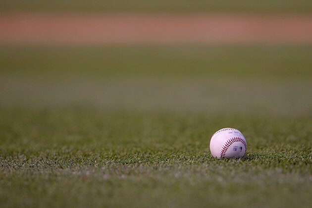 DENVER, CO - JUNE 11:  The ball lies on the grass as the Atlanta Braves face the Colorado Rockies at Coors Field on June 11, 2014 in Denver, Colorado.  (Photo by Doug Pensinger/Getty Images)