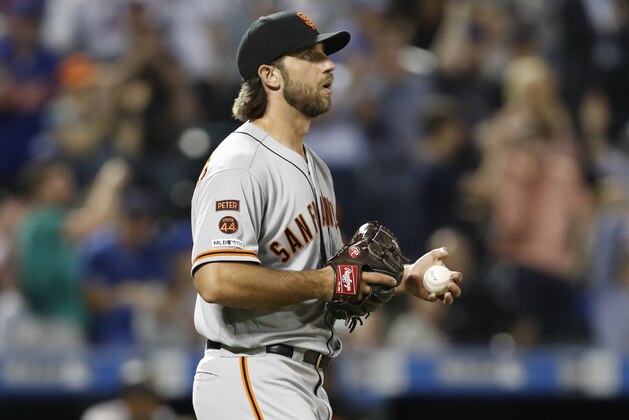 San Francisco Giants starting pitcher Madison Bumgarner follows the path Wilson Ramos's two-run, home run, during the sixth inning of a baseball game against the New York Mets, Tuesday, June 4, 2019, in New York. (AP Photo/Kathy Willens)