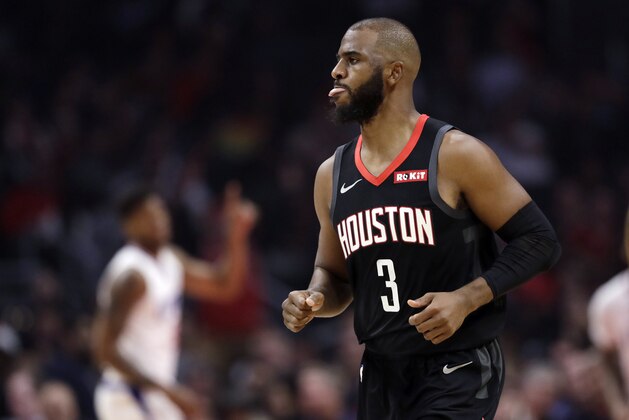 Houston Rockets' Chris Paul reacts after making a 3-point basket against the Los Angeles Clippers during the first half of an NBA basketball game Wednesday, April 3, 2019, in Los Angeles. (AP Photo/Marcio Jose Sanchez)