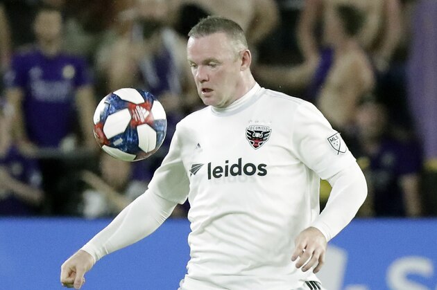 D.C. United's Wayne Rooney moves the ball against Orlando City during the second half of an MLS soccer match, Sunday, March 31, 2019, in Orlando, Fla. (AP Photo/John Raoux)