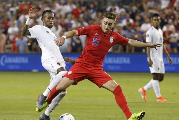 Panama midfielder Marcos Sanchez (8) pressures U.S. forward Tyler Boyd (21) during the second half of a CONCACAF Gold Cup soccer match in Kansas City, Kan., Wednesday, June 26, 2019. The United States won 1-0. (AP Photo/Colin E. Braley)