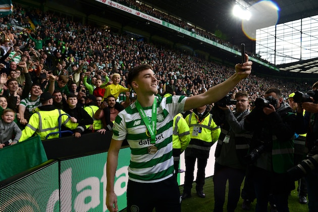 GLASGOW, SCOTLAND - MAY 19: Kieran Tierney of Celtic takes a selfie with the Celtic fans during the Ladbrokes Scottish Premiership match between Celtic FC and Heart of Midlothian FC at Celtic Park on May 19, 2019 in Glasgow, Scotland. (Photo by Mark Runnacles/Getty Images)