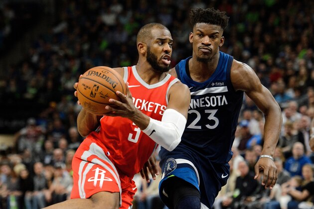 MINNEAPOLIS, MN - APRIL 23: Chris Paul #3 of the Houston Rockets drives to the basket against Jimmy Butler #23 of the Minnesota Timberwolves in Game Four of Round One of the 2018 NBA Playoffs on April 23, 2018 at the Target Center in Minneapolis, Minnesota. The Rockets defeated the Timberwolves 119-100. NOTE TO USER: User expressly acknowledges and agrees that, by downloading and or using this Photograph, user is consenting to the terms and conditions of the Getty Images License Agreement. (Photo by Hannah Foslien/Getty Images)