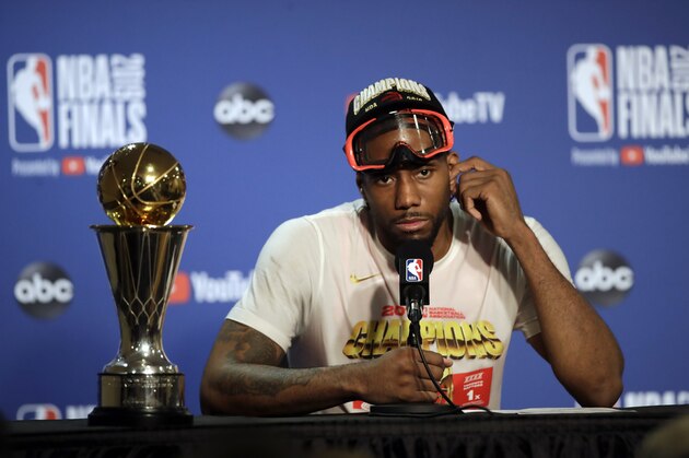 Toronto Raptors forward Kawhi Leonard speaks at a news conference alongside the NBA Finals Most Valuable Player trophy after the Raptors defeated the Golden State Warriors in Game 6 of basketball's NBA Finals in Oakland, Calif., Thursday, June 13, 2019. (AP Photo/Ben Margot)