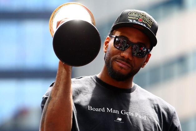 TORONTO, ON - JUNE 17:  Kawhi Leonard #2 of the Toronto Raptors holds the MVP trophy during the Toronto Raptors Victory Parade on June 17, 2019 in Toronto, Canada. The Toronto Raptors beat the Golden State Warriors 4-2 to win the 2019 NBA Finals.  NOTE TO USER: User expressly acknowledges and agrees that, by downloading and or using this photograph, User is consenting to the terms and conditions of the Getty Images License Agreement.  (Photo by Vaughn Ridley/Getty Images)