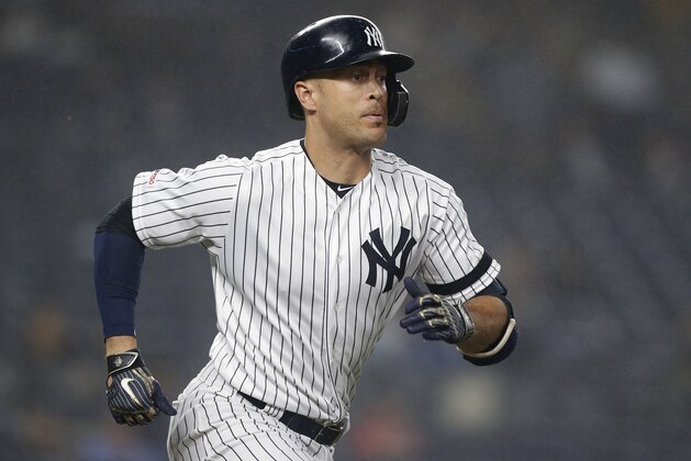 NEW YORK, NEW YORK - JUNE 18:   Giancarlo Stanton #27 of the New York Yankees in action against the Tampa Bay Rays at Yankee Stadium on June 18, 2019 in New York City. The Yankees defeated the Rays 6-3. (Photo by Jim McIsaac/Getty Images)