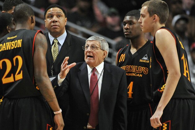 FILE - In this March 30, 2011 file photo, West head coach Gene Pingatore, from St. Joseph High School in Westchester, Ill., talks to his team during the first half of the McDonald's All-American High School boys' basketball game in Chicago. Pingatore, the winningest boys basketball coach in Illinois history who gained national attention when he appeared in the 1994 documentary