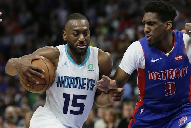 Charlotte Hornets guard Kemba Walker (15) drives against Detroit Pistons guard Langston Galloway (9) during the second half of an NBA basketball game Sunday, April 7, 2019, in Detroit. (AP Photo/Duane Burleson)