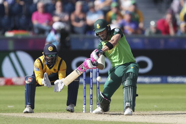 South Africa's captain Faf du Plessis, right, plays a shot as Sri Lanka's wicketkeeper Kusal Perera watches on during the Cricket World Cup match between Sri Lanka and South Africa at the Riverside Ground in Chester-le-Street, England, Friday, June 28, 2019. (AP Photo/Scott Heppell)