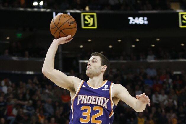 Phoenix Suns guard Jimmer Fredette (32) shoots during the first half of an NBA basketball game Monday, March 25, 2019, in Salt Lake City. (AP Photo/Rick Bowmer)