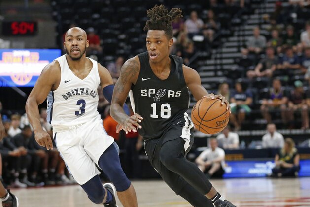 San Antonio Spurs guard Lonnie Walker IV (18) drives as Memphis Grizzlies guard Jevon Carter (3) trails during the first half of an NBA summer league basketball game Thursday, July 5, 2018, in Salt Lake City. (AP Photo/Rick Bowmer)