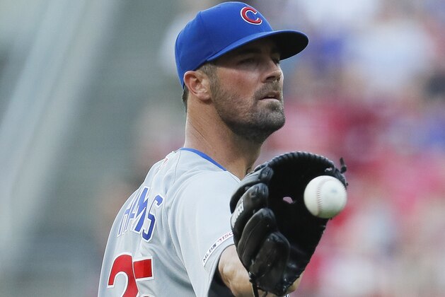 Chicago Cubs starting pitcher Cole Hamels receives the ball in the first inning of a baseball game against the Cincinnati Reds, Friday, June 28, 2019, in Cincinnati. (AP Photo/John Minchillo)