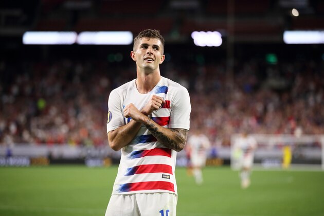 CLEVELAND, OH - JUNE 22: Christian Pulisic of USA celebrates after scoring a goal to make it 4-0 during the Group D 2019 CONCACAF Gold Cup fixture between United States of America and Trinidad & Tobago at FirstEnergy Stadium on June 22, 2019 in Cleveland, Ohio. (Photo by Matthew Ashton - AMA/Getty Images)