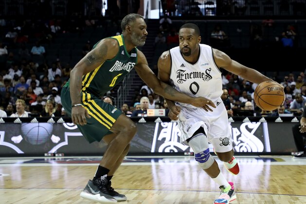 CHARLOTTE, NORTH CAROLINA - JUNE 29: Gilbert Arenas #0 of Enemies drives to the basket against Qyntel Woods #6 of Ball Hogs during week two of the BIG3 three on three basketball league at Spectrum Center on June 29, 2019 in Charlotte, North Carolina. (Photo by Streeter Lecka/BIG3/Getty Images)