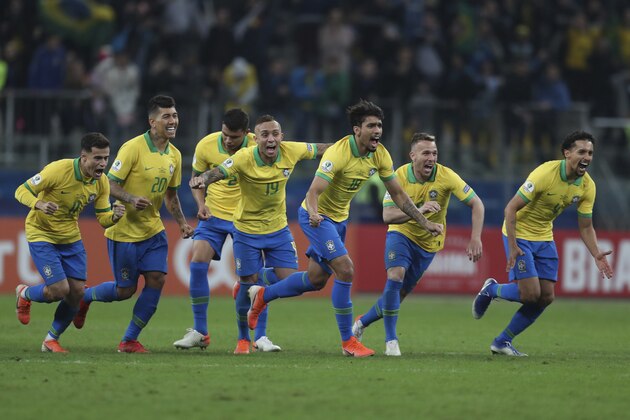 Brazil's soccer players celebrate winning at the end of the Copa America quarterfinal soccer match against Paraguay at the Arena do Gremio in Porto Alegre, Brazil, Thursday, June 27, 2019. (AP Photo/Natacha Pisarenko)