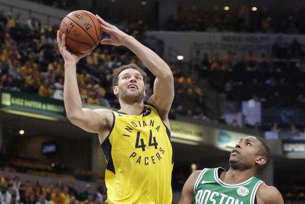 Indiana Pacers forward Bojan Bogdanovic (44) shoots over Boston Celtics center Al Horford (42) during the second half of Game 4 of an NBA basketball first-round playoff series in Indianapolis, Sunday, April 21, 2019. The Celtics defeated the Pacers 110-106 to win the series 4-0. (AP Photo/Michael Conroy)