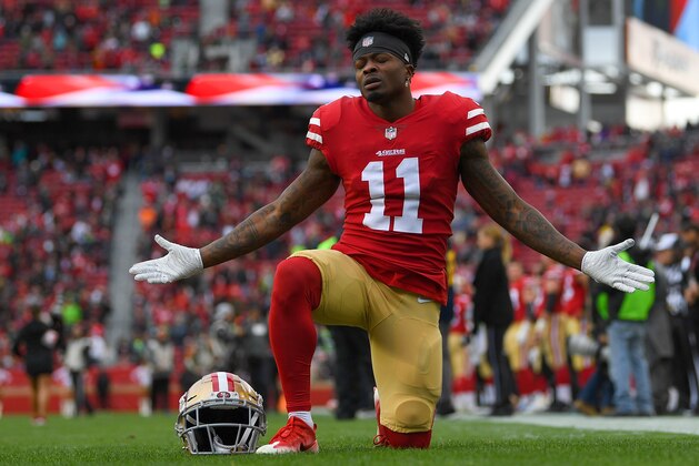 SANTA CLARA, CA - DECEMBER 16:  Marquise Goodwin #11 of the San Francisco 49ers kneels in the endzone and prays prior to the start of an NFL football game against the Seattle Seahawks at Levi's Stadium on December 16, 2018 in Santa Clara, California.  (Photo by Thearon W. Henderson/Getty Images)