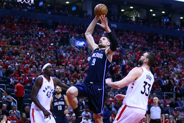 TORONTO, ON - APRIL 23:  Nikola Vucevic #9 of the Orlando Magic shoots the ball during Game Five of the first round of the 2019 NBA Playoffs against the  Toronto Raptorsat Scotiabank Arena on April 23, 2019 in Toronto, Canada.  NOTE TO USER: User expressly acknowledges and agrees that, by downloading and or using this photograph, User is consenting to the terms and conditions of the Getty Images License Agreement.  (Photo by Vaughn Ridley/Getty Images)