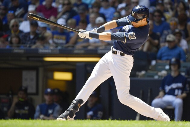 MILWAUKEE, WISCONSIN - JUNE 27: Christian Yelich #22 of the Milwaukee Brewers gets a hit in the third inning against the Seattle Mariners at Miller Park on June 27, 2019 in Milwaukee, Wisconsin. (Photo by Quinn Harris/Getty Images)
