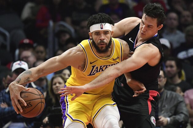Los Angeles Clippers forward Danilo Gallinari, right, reaches in on Los Angeles Lakers center JaVale McGee during the first half of an NBA basketball game Friday, April 5, 2019, in Los Angeles. (AP Photo/Mark J. Terrill)