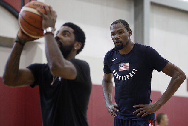 Kevin Durant, right, watches Kyrie Irving during a training camp for USA Basketball, Thursday, July 26, 2018, in Las Vegas. (AP Photo/John Locher)
