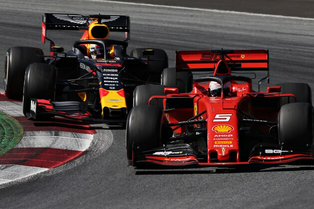 SPIELBERG, AUSTRIA - JUNE 30: Sebastian Vettel of Germany driving the (5) Scuderia Ferrari SF90 leads Max Verstappen of the Netherlands driving the (33) Aston Martin Red Bull Racing RB15 on track during the F1 Grand Prix of Austria at Red Bull Ring on June 30, 2019 in Spielberg, Austria. (Photo by Charles Coates/Getty Images)