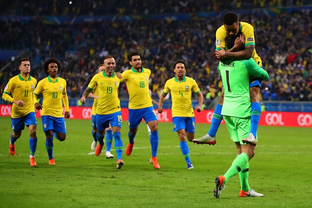 PORTO ALEGRE, BRAZIL - JUNE 27: Gabriel Jesus of Brazil is congratulated by team-mate Alisson after scoring the winning penalty in the shoot out following the Copa America Brazil 2019 quarterfinal match between Brazil and Paraguay at Arena do Gremio on June 27, 2019 in Porto Alegre, Brazil. (Photo by Chris Brunskill/Fantasista/Getty Images)