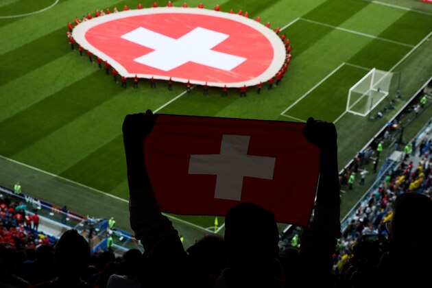 SAINT PETERSBURG, RUSSIA - JULY 03:  Fan of Switzerland show his flag during the 2018 FIFA World Cup Russia Round of 16 match between 1st Group F and 2nd Group E at Saint Petersburg Stadium on July 3, 2018 in Saint Petersburg, Russia.  (Photo by Zhizhao Wu/Getty Images)
