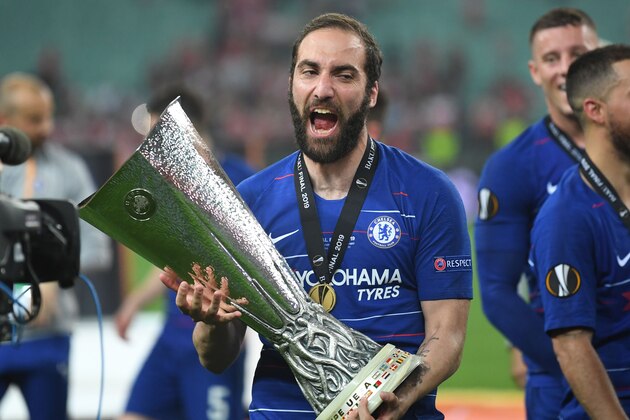 Chelsea's Argentinian striker Gonzalo Higuain celebrates with the trophy after winning the UEFA Europa League final football match between Chelsea FC and Arsenal FC at the Baku Olympic Stadium in Baku, Azerbaijian, on May 29, 2019. (Photo by OZAN KOSE / AFP)        (Photo credit should read OZAN KOSE/AFP/Getty Images)