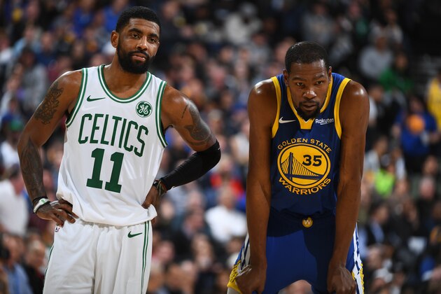 OAKLAND, CA - MARCH 5: Kyrie Irving #11 of the Boston Celtics and Kevin Durant #35 of the Golden State Warriors looks on during the game on March 5, 2019 at ORACLE Arena in Oakland, California. NOTE TO USER: User expressly acknowledges and agrees that, by downloading and or using this photograph, user is consenting to the terms and conditions of Getty Images License Agreement. Mandatory Copyright Notice: Copyright 2019 NBAE (Photo by Garrett Ellwood/NBAE via Getty Images) OAKLAND, CA - MARCH 5: Kyrie Irving #11 of the Boston Celtics and Kevin Durant #35 of the Golden State Warriors looks on during the game on March 5, 2019 at ORACLE Arena in Oakland, California. NOTE TO USER: User expressly acknowledges and agrees that, by downloading and or using this photograph, user is consenting to the terms and conditions of Getty Images License Agreement. Mandatory Copyright Notice: Copyright 2019 NBAE (Photo by Garrett Ellwood/NBAE via Getty Images)