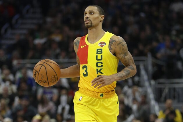 Milwaukee Bucks' George Hill dribbles during the second half of an NBA basketball game against the Atlanta Hawks Sunday, April 7, 2019, in Milwaukee. (AP Photo/Aaron Gash)
