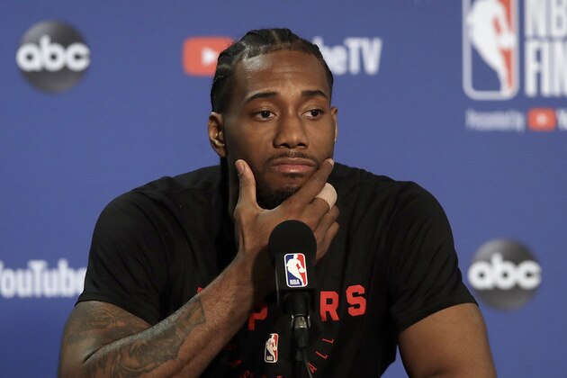 Toronto Raptors forward Kawhi Leonard speaks to reporters before a team practice in Oakland, Calif., Wednesday, June 12, 2019. The Raptors are scheduled to play the Golden State Warriors in Game 6 of basketball's NBA Finals on Thursday. (AP Photo/Jeff Chiu)