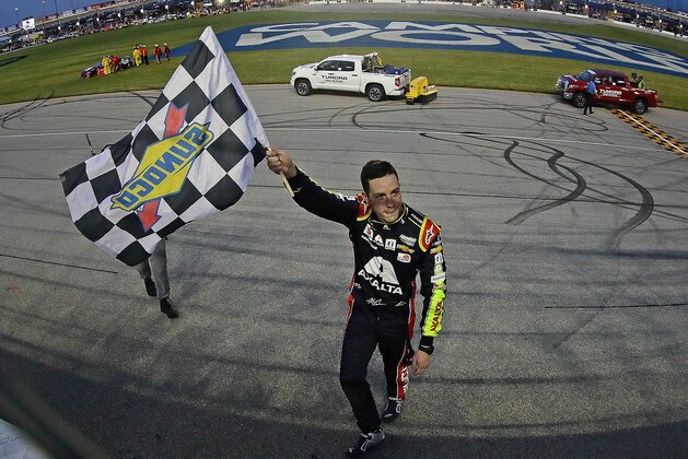 JOLIET, ILLINOIS - JUNE 30: Alex Bowman, driver of the #88 Axalta Chevrolet, waves the checkered flag after winning the Monster Energy NASCAR Cup Series Camping World 400 at Chicagoland Speedway on June 30, 2019 in Joliet, Illinois. (Photo by Jonathan Daniel/Getty Images)