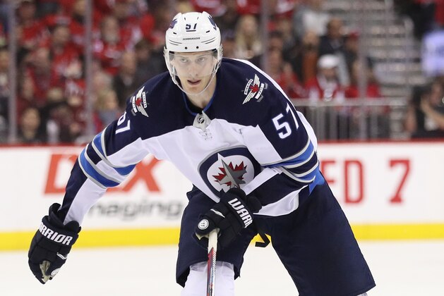 WASHINGTON, DC - MARCH 10: Tyler Myers #57 of the Winnipeg Jets 
skates against the Washington Capitals during the second period at Capital One Arena on March 10, 2019 in Washington, DC. (Photo by Patrick Smith/Getty Images)