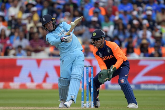 England's Jason Roy (L) plays a shot as India's wicketkeeper Mahendra Singh Dhoni looks on during the 2019 Cricket World Cup group stage match between England and India at Edgbaston in Birmingham, central England, on June 30, 2019. (Photo by Dibyangshu Sarkar / AFP) / RESTRICTED TO EDITORIAL USE        (Photo credit should read DIBYANGSHU SARKAR/AFP/Getty Images)