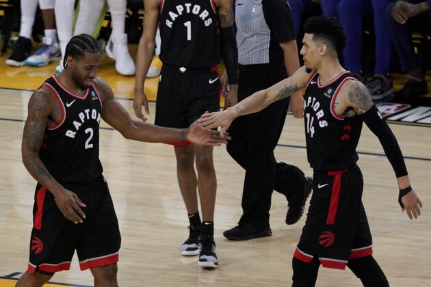 Toronto Raptors forward Kawhi Leonard (2) celebrates with Danny Green during the first half of Game 3 of basketball's NBA Finals against the Golden State Warriors in Oakland, Calif., Wednesday, June 5, 2019. (AP Photo/Tony Avelar)