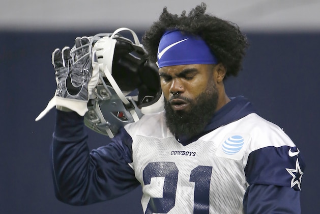 Dallas Cowboys running back Ezekiel Elliott (21) walks the field during an organized team activity at its NFL football training facility in Frisco, Texas, Wednesday, May 29, 2019. (AP Photo/Ron Jenkins)