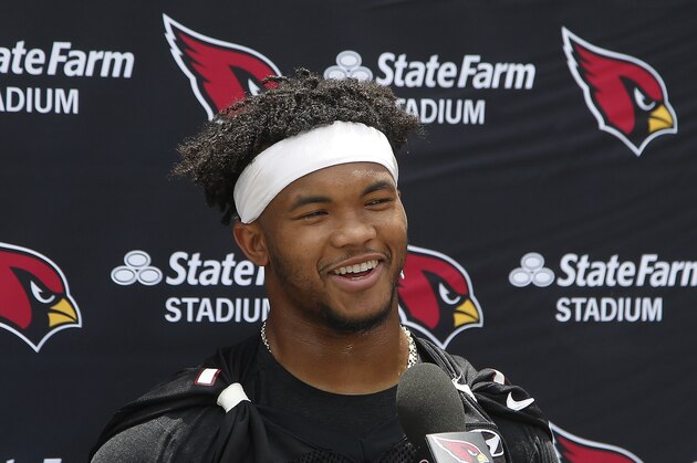Arizona Cardinals rookie quarterback Kyler Murray smiles as he speaks to the media after practice at the team's NFL football training facility Tuesday, June 11, 2019, in Tempe, Ariz. (AP Photo/Ross D. Franklin)
