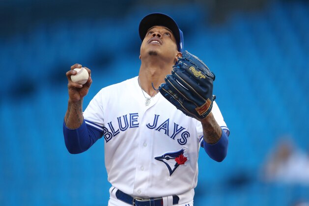 TORONTO, ON - JUNE 07: Marcus Stroman #6 of the Toronto Blue Jays says a prayer on the mound before pitching in the first inning during MLB game action against the Arizona Diamondbacks at Rogers Centre on June 7, 2019 in Toronto, Canada. (Photo by Tom Szczerbowski/Getty Images)